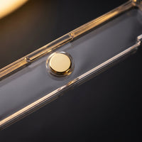 Macro of the gold magnet disc seated in the acrylic 35PT card holder