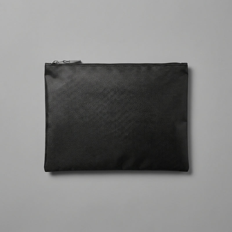 Fire-resistant card storage bag lying flat and zipped on a neutral background