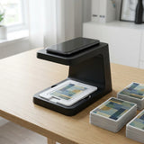 Card scanner stand on a desk holding a phone above a card tray ready for bulk scanning