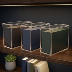 Three acrylic Elite Trainer Box display cases lined up on a lit shelf