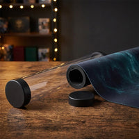 Playmat Storage Tube — open tube with rolled playmat on a game table